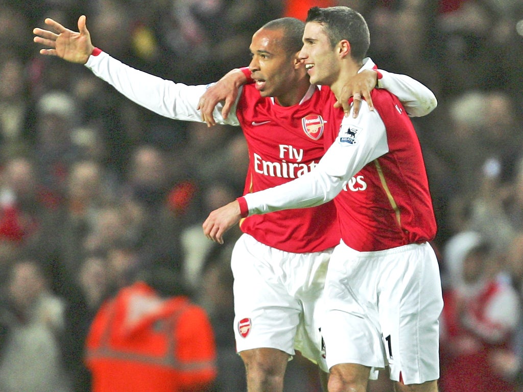 Henry and van Persie celebrate a goal during the Frenchman's first spell at Arsenal