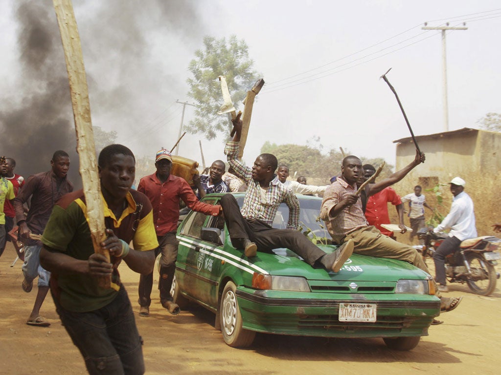 Demonstrators protest against the elimination of the popular fuel subsidy