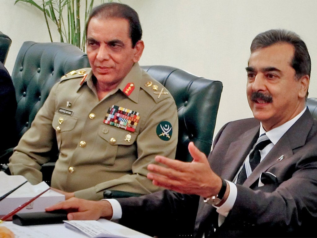 Prime Minister Yousuf Raza Gilani, right, accuses the army chief General Ashfaq Parvez Kayani, left, of acting unconstitutionally