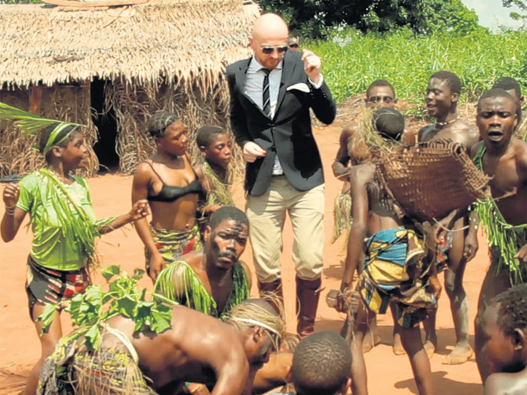 Two tribes: director Mads Brugger dancing with Pygmies