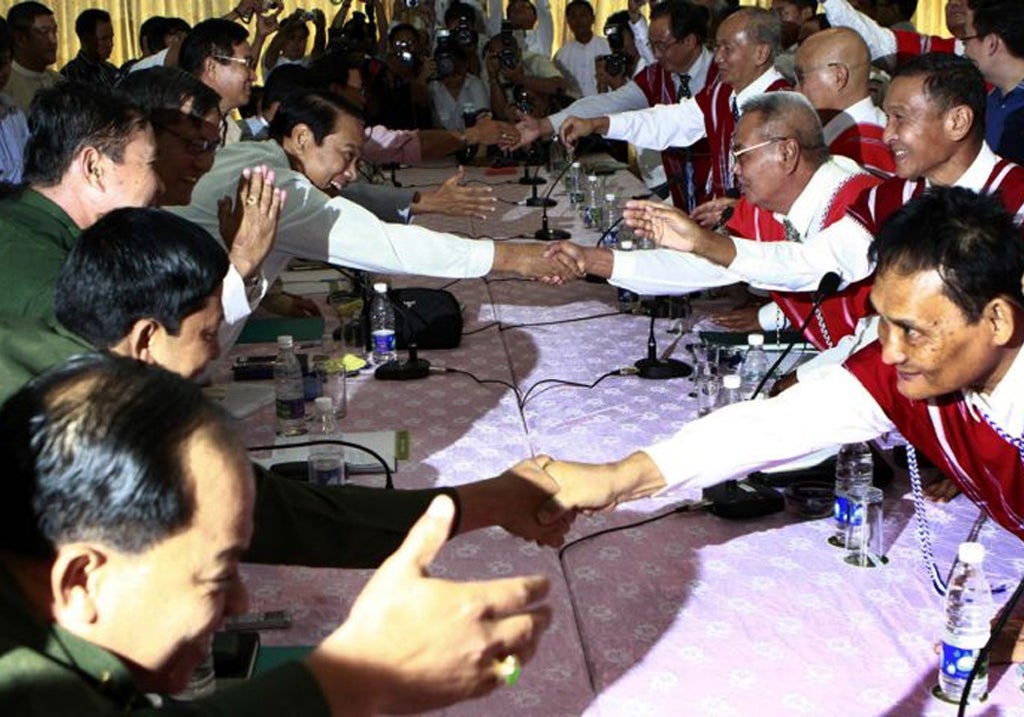 Burma's peace committee, left, meets members of the KNU in Pa-an