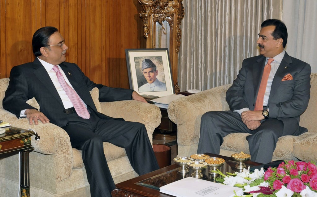 Pakistan's Prime Minister Yousuf Raza Gilani, right, talks with Pakistan's President Asif Ali Zardari
