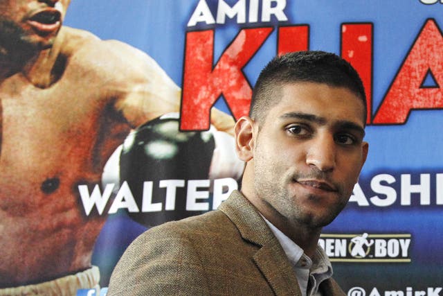 Amir Khan who lost his WBA and IBF titles in a split-decision defeat in Peterson's Washington DC hometown on 10 December