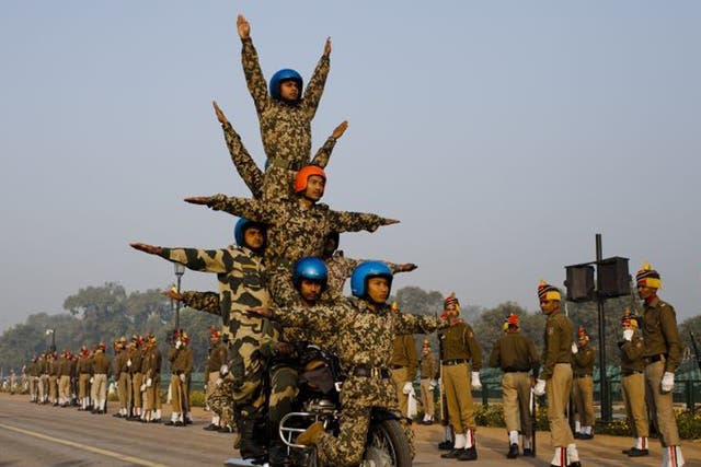 Indian soldiers perfect their stunts on Royal Enfield motorcycles in preparation for India's Republic Day on 26 January