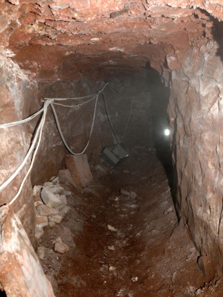 The thieves dug the tunnel from a railway embankment at the rear of the shop. It went under a car park and beneath the foundations of the store.