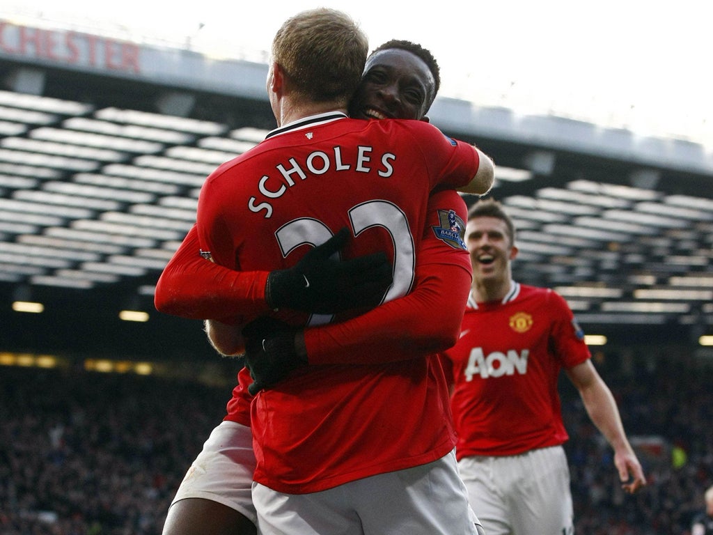 Danny Welbeck and Michael Carrick are all smiles after Paul Scholes scored for Manchester United against Bolton Wanderers yesterday