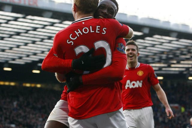 Danny Welbeck and Michael Carrick are all smiles after Paul Scholes scored for Manchester United against Bolton Wanderers yesterday