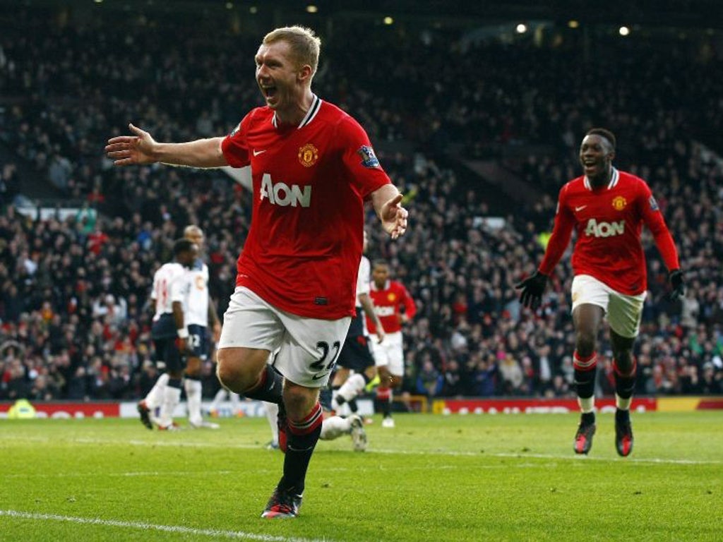 Paul Scholes celebrates after scoring Manchester United's opener against Bolton