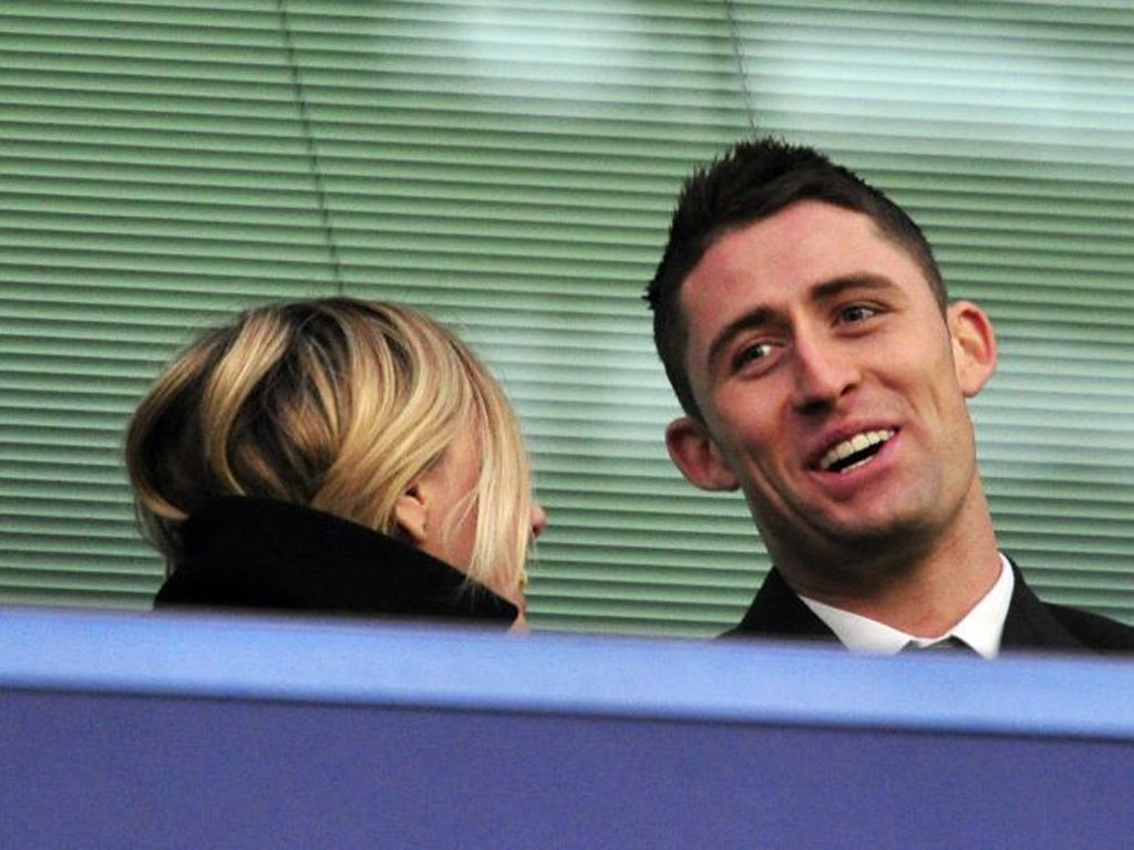 Gary Cahill watches his new Chelsea team-mates in action from the
stands on Saturday