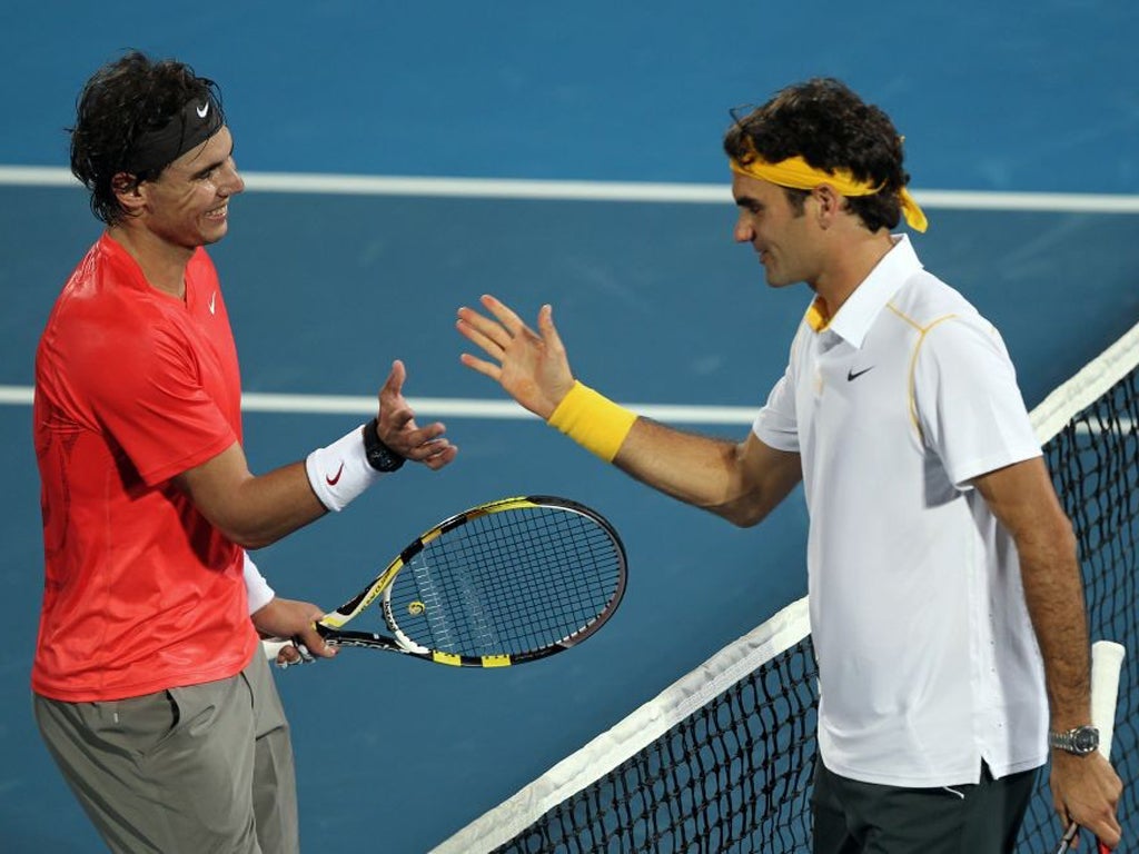 Rafael Nadal (left) and Roger Federer have had a rare disagreement over possible action about conditions on the tour