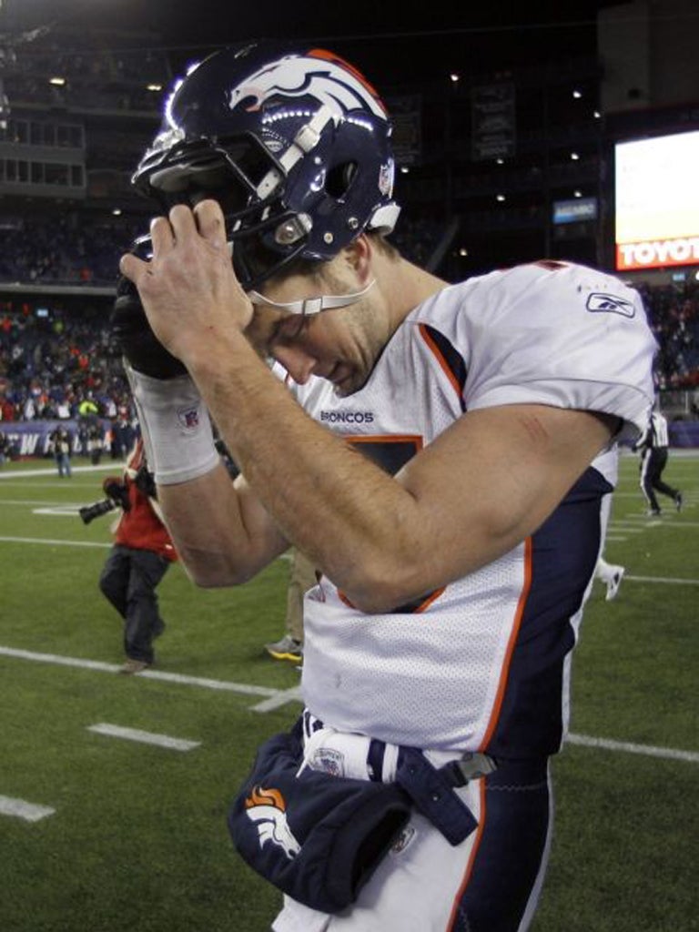 Denver quarterback Tim Tebow is bowed by defeat to New England