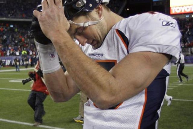 Denver quarterback Tim Tebow is bowed by defeat to New England