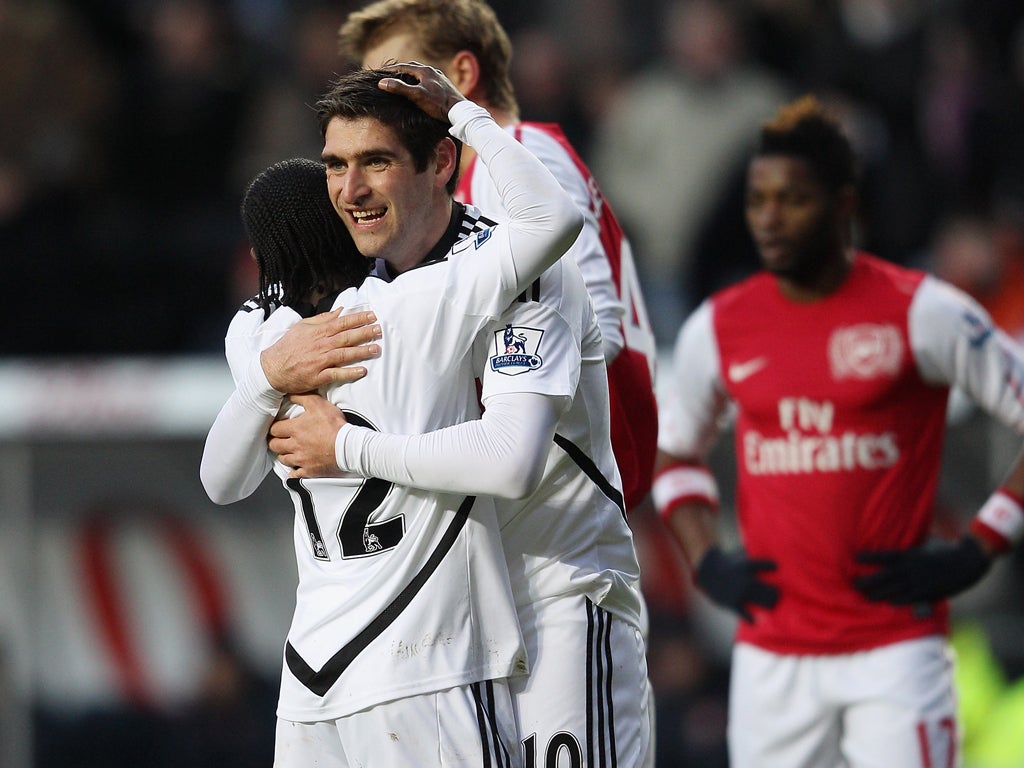 Danny Graham of Swansea City hugs Nathan Dyer after Swansea were awarded a penalty