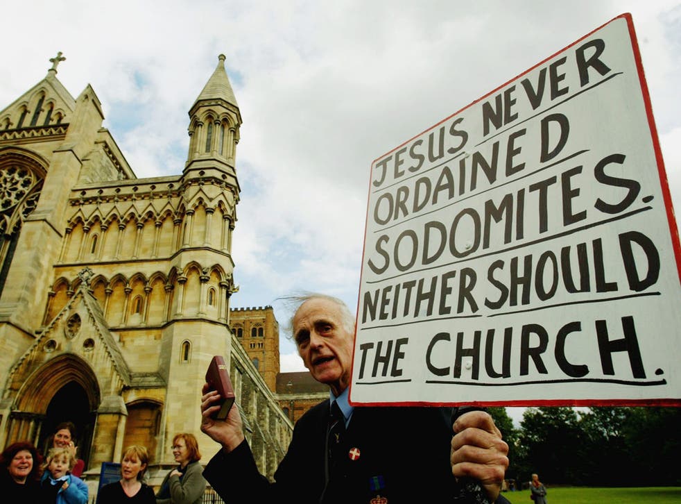 A protester at St Albans Cathedral when Dr John was appointed in 2004