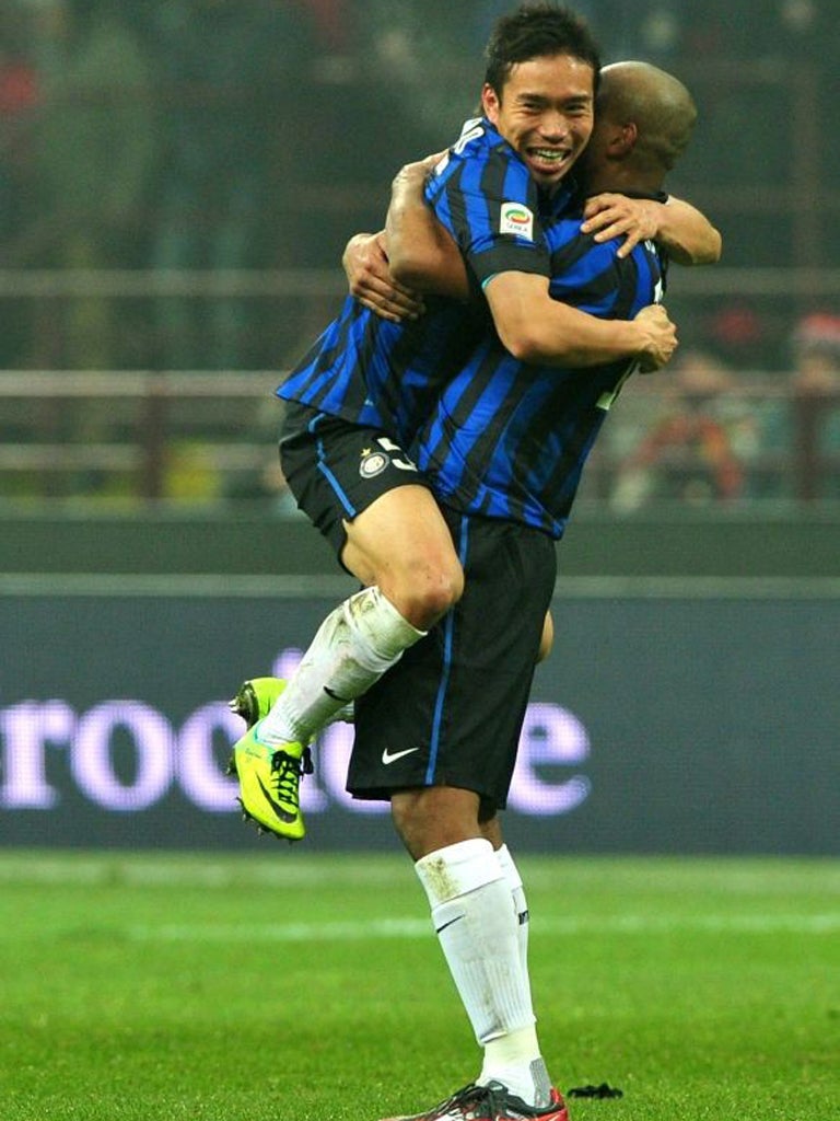 Internazionale's Yuto Nagatomo and Maicon celebrate victory