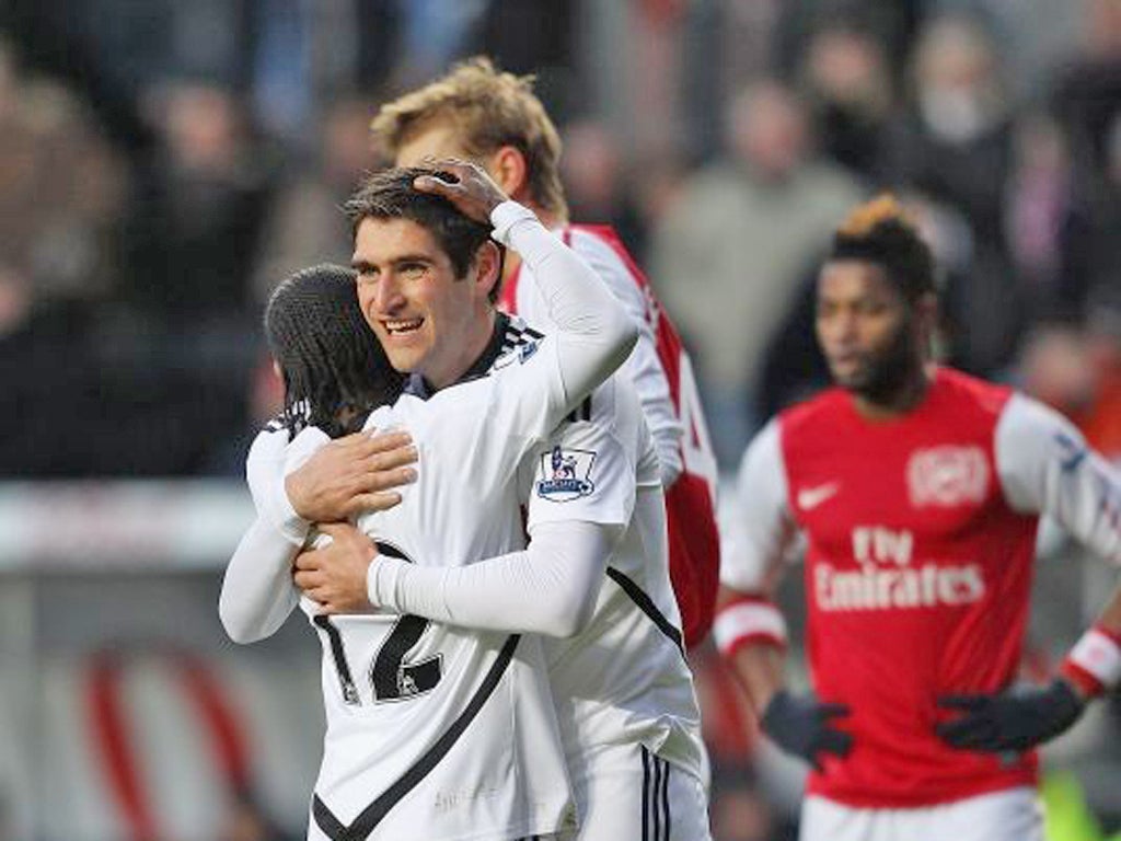Match-winner Danny Graham hugs Nathan Dyer after Swansea were awarded a penalty