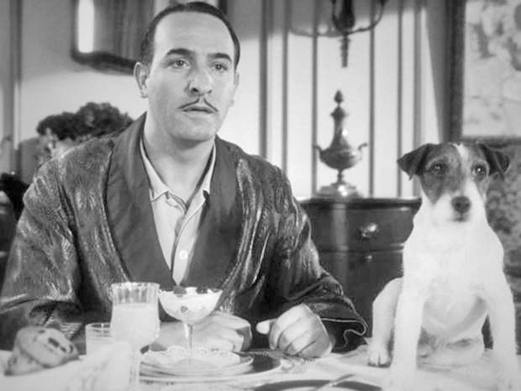 The silent film star George Valentin, played by Jean Dujardin and Uggie, the Jack Russell in ‘The Artist’ (2011)