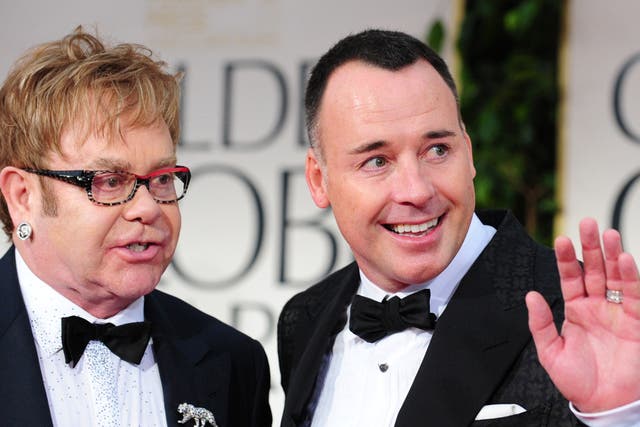 Sir Elton John (L) and David Furnish