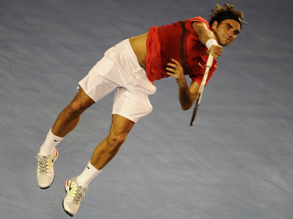 Roger Federer showed no sign of back trouble as he cruised into the second round of the Australian Open today with a 7-5 6-2 6-2 victory over qualifier Alexander Kudryavtsev.