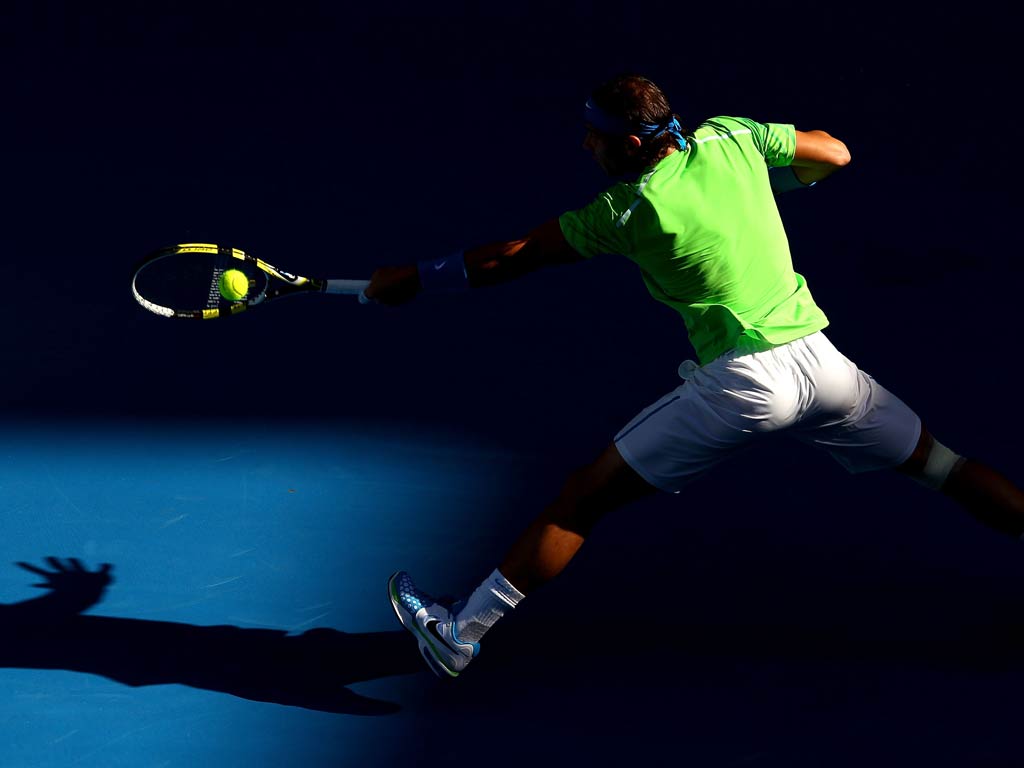 Rafael Nadal swatted away the threat posed by American qualifier Alex Kuznetsov to reach the second round at the Australian Open.