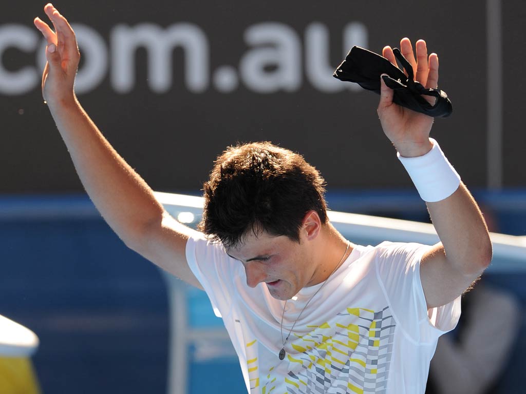 Bernard Tomic thrilled the Melbourne crowd by hitting back from two sets down to stun 22nd seed Fernando Verdasco on the opening day of the Australian Open.
