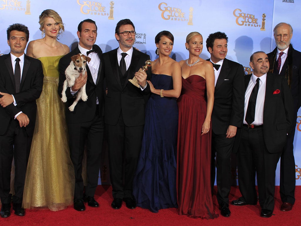 The cast, director, producer and composer of The Artist -  winner of best comedy or musical motion picture