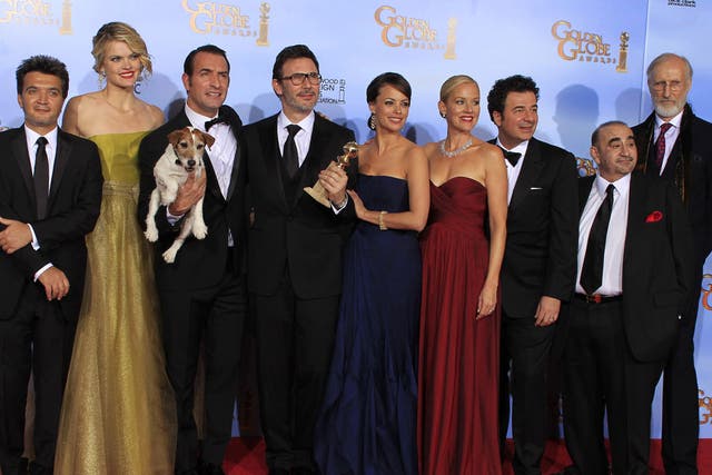 The cast, director, producer and composer of The Artist -  winner of best comedy or musical motion picture