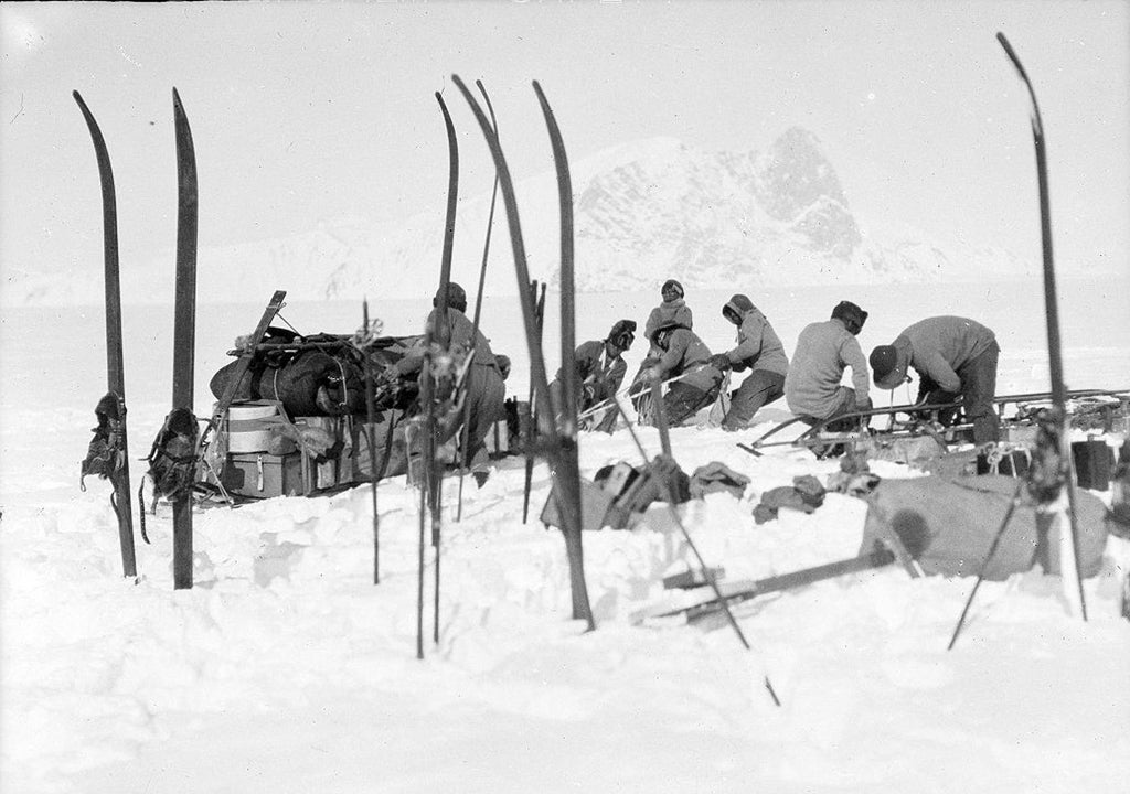 A photograph taken by Captain Scott on his final expedition of Bowers' sledge team on Beardmore Glacier.