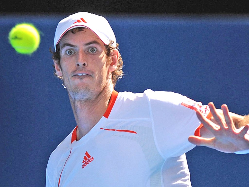 Andy Murray focuses on the ball rather than shouting at his entourage