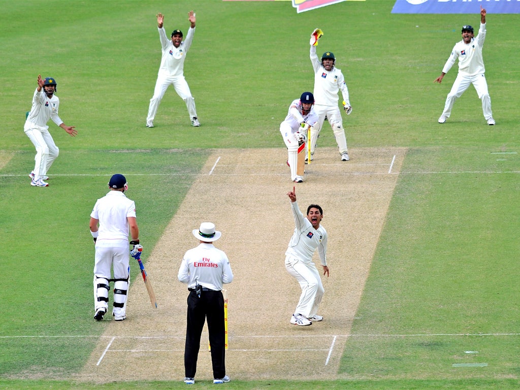 Saeed Ajmal celebrates the dismissal of Jimmy Anderson, his seventh England victim