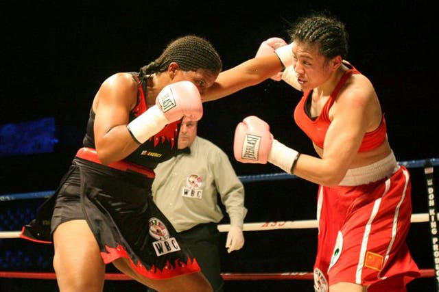 Boxing authorities will have to decide whether women boxers should wear skirts, as in the South African bout above, or shorts at the Olympics