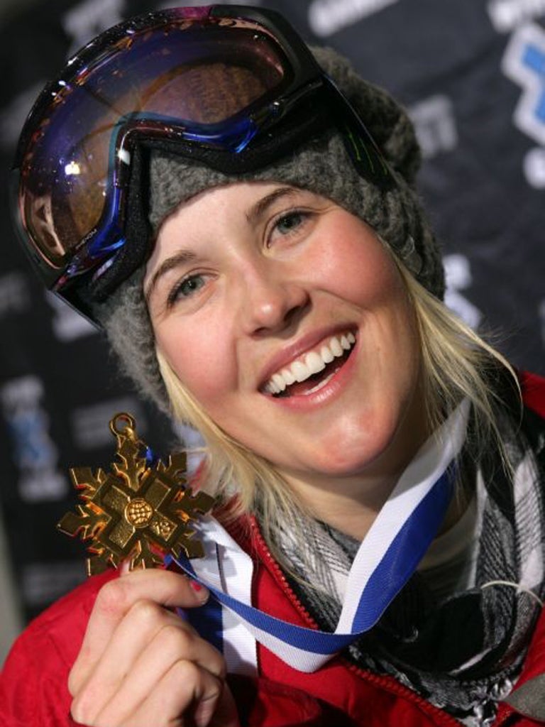 Burke shows her medal from the women's Superpipe event at the Winter X Games 