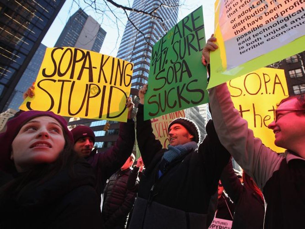 Protesters demonstrate against the proposed Stop Online Piracy Act and Protect IP Act in New York yesterday