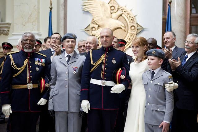 (Front row from left) John Kani portrays General Cominius, Vanessa Redgrave portrays Volumina, Ralph Fiennes portrays Caius Martius, Jessica Chastain portrays Virgilia and Henry Fenn portrays Young Martius in a scene from Coriolanis