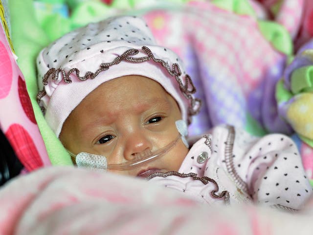 Five-month-old Melinda Guido goes home with her mother