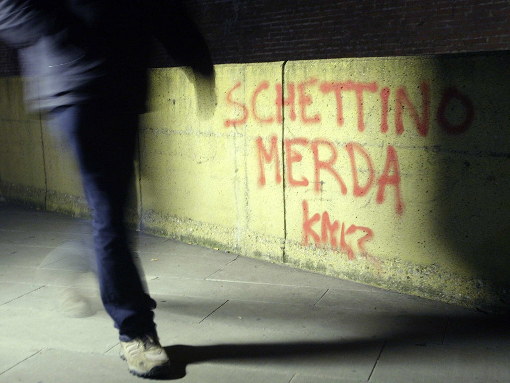 Graffiti outside an Italian prison reads: 'Schettino shit'