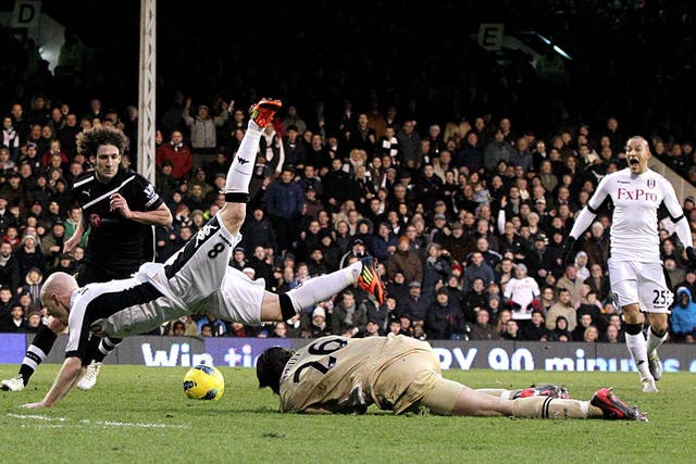 Andy Johnson is sent tumbling by goalkeeper Tim Krul, which led to Fulham’s second penalty