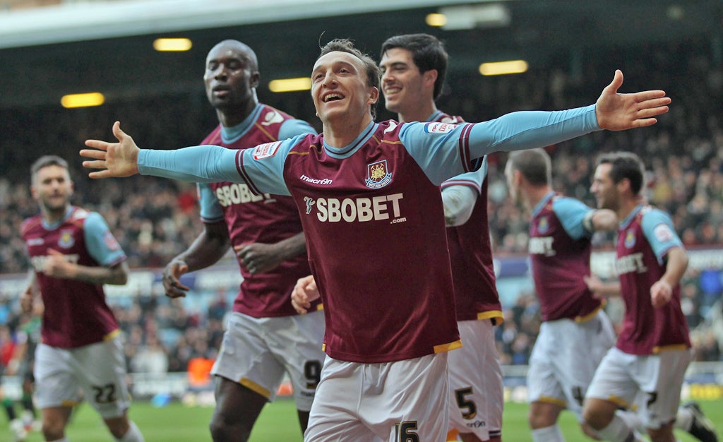 Mark Noble celebrates scoring one of his two penalties