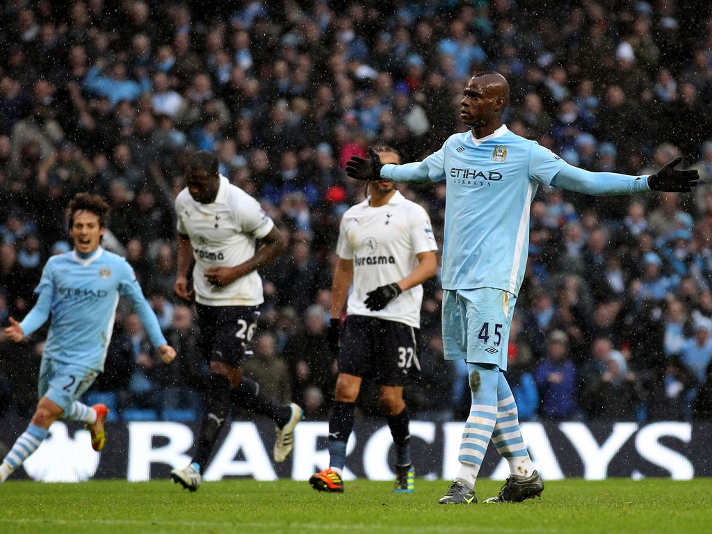 Mario Balotelli of Manchester City celebrates after scoring the winner in a thrilling contest against Spurs