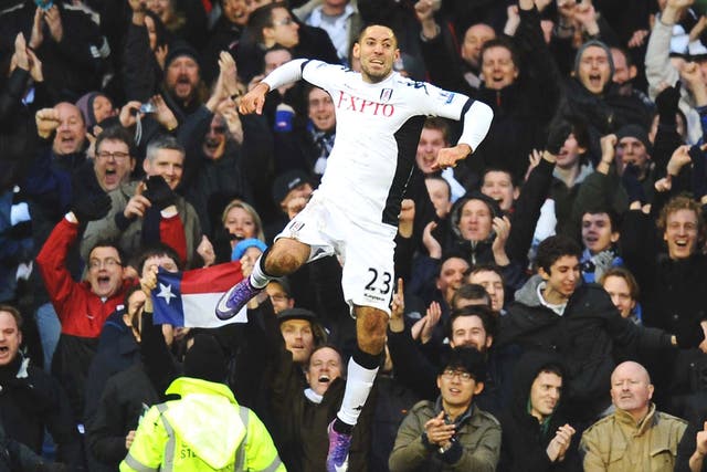 Fulham’s hat-trick hero Clint Dempsey celebrates
during the demolition of Newcastle
