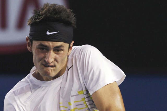 BERNARD TOMIC: The Australian’s exploits came
to an end at the hands of Roger Federer