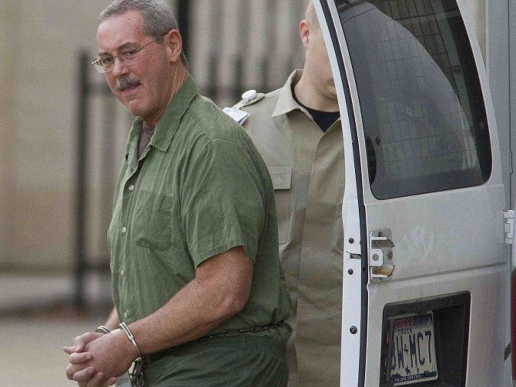 Cladin prison clothes Allen Stanford arrives at court on 23 January