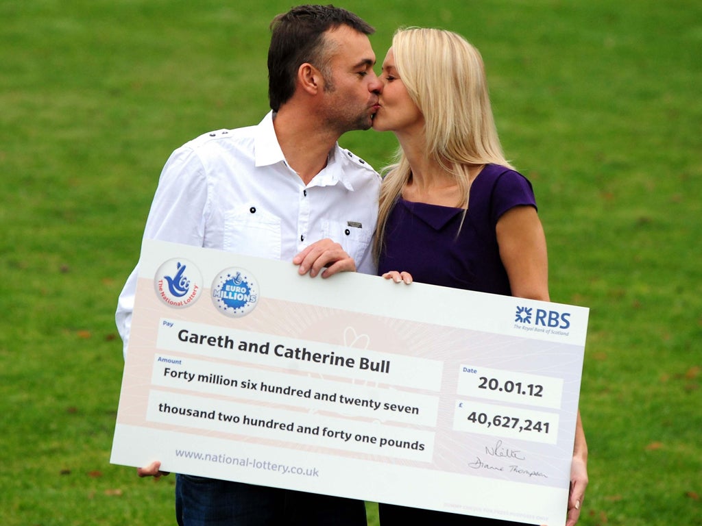 Gareth and Catherine Bull celebrate after they scooped the rollover jackpot of £40,627,241 in the EuroMillions draw