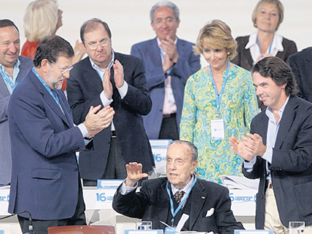 Political giant: Fraga, seated, is applauded by his parliamentary colleagues in a tribute in 2008