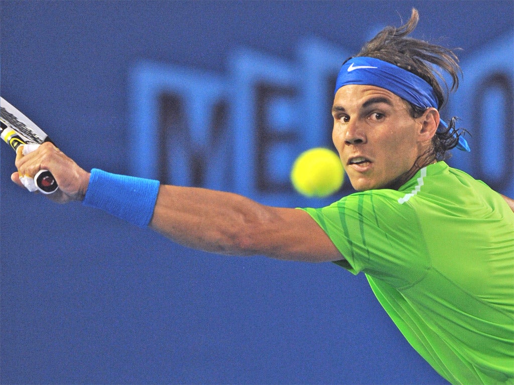 Rafael Nadal hits a return during his thrilling win over Tomas Berdych