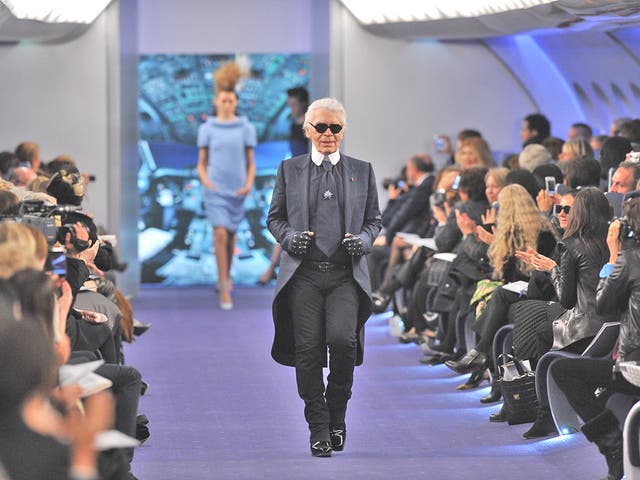 Karl Lagerfeld takes the applause after the Chanel haute couture show at the Grand Palais in Paris