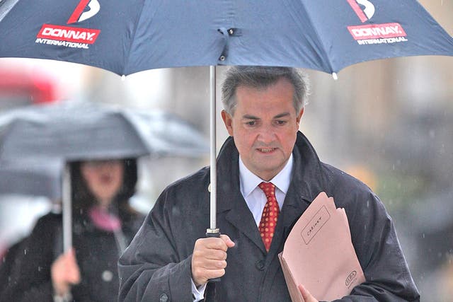 Chris Huhne is waiting to hear if he will be charged over speeding allegations