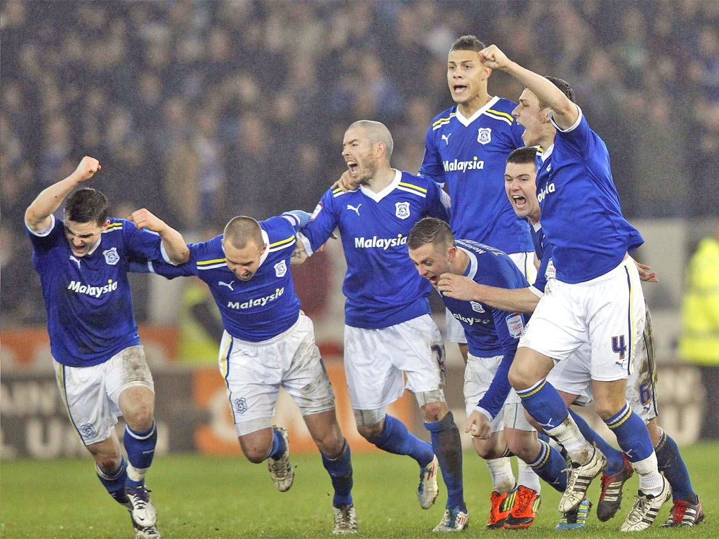Cardiff City players start to celebrate their 3-1 victory on penalties over Crystal Palace in their Carling Cup semi-final second leg last night