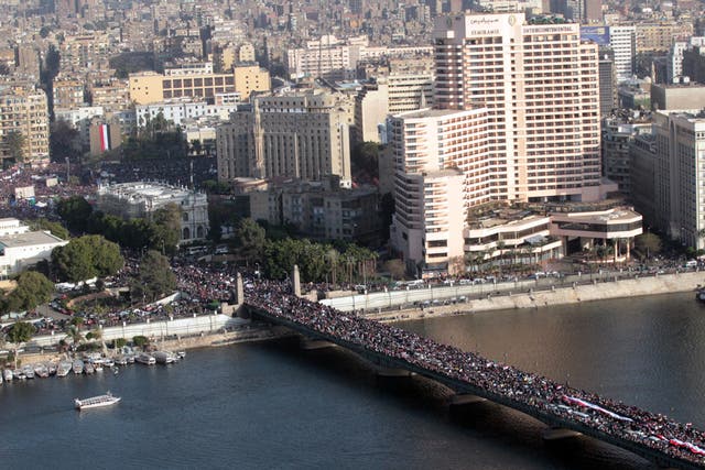 Protesters celebrate the one year annivesary of the 25th January uprising in Cairo