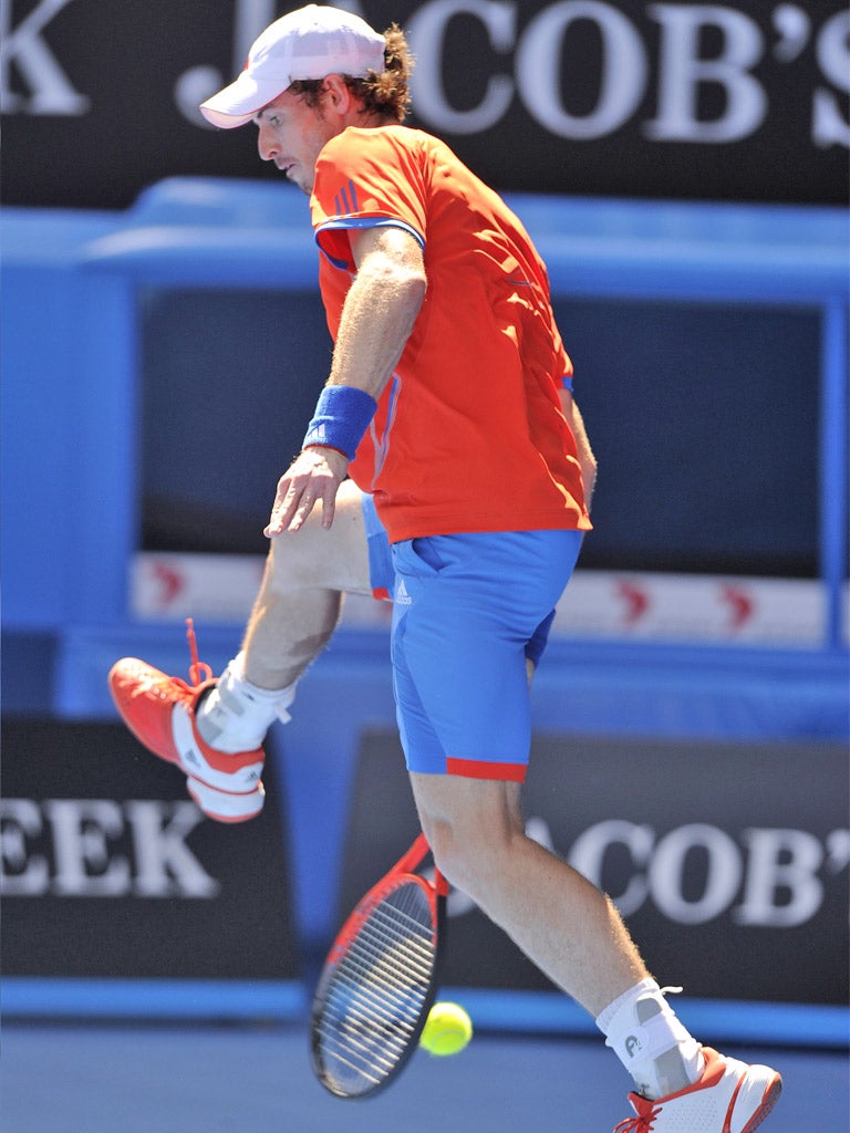Andy Murray tries a through-the-legs return to Kei Nishikori during
their quarter-final yesterday